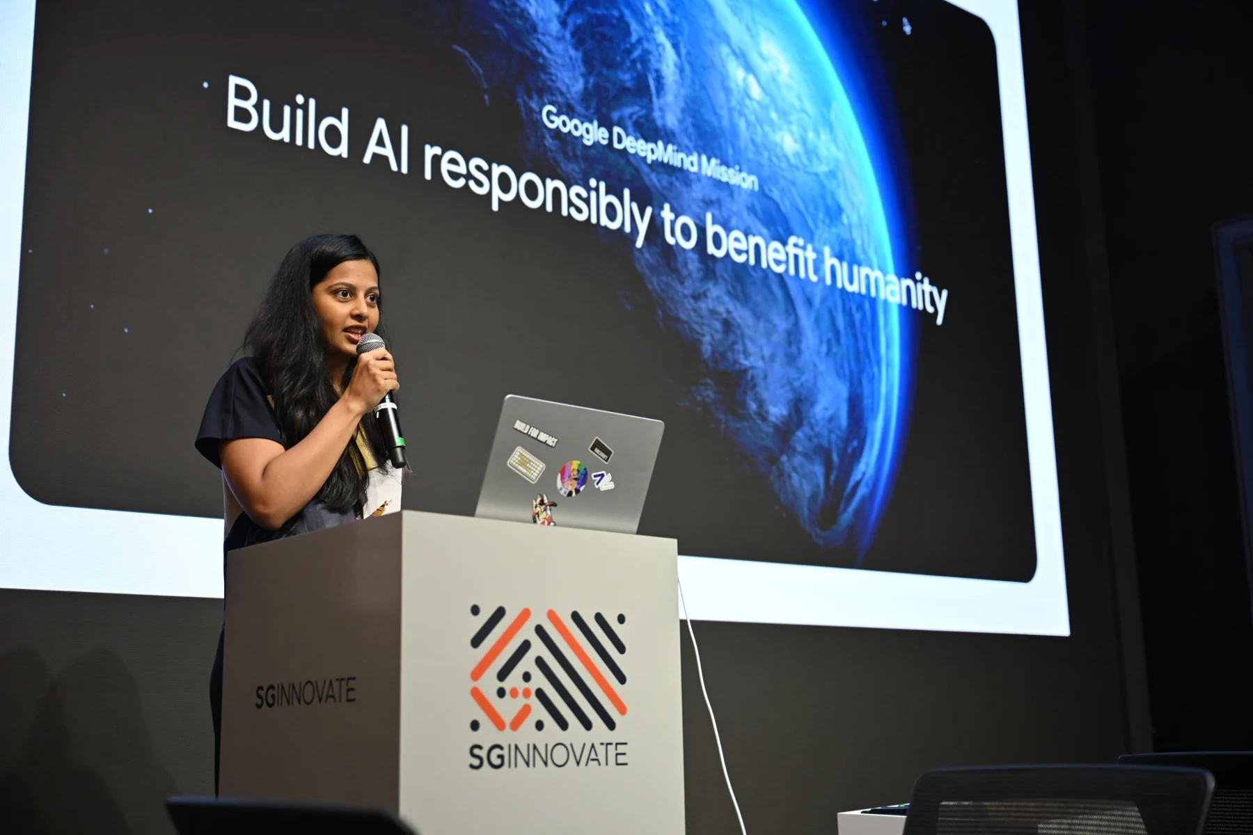 A Google DeepMind speaker presenting at SGInnovate