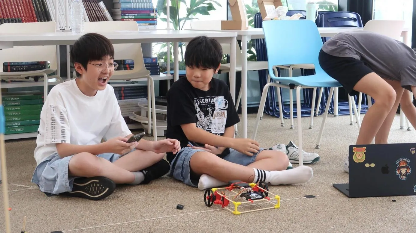 Students testing a robot at AI Tinkery camp