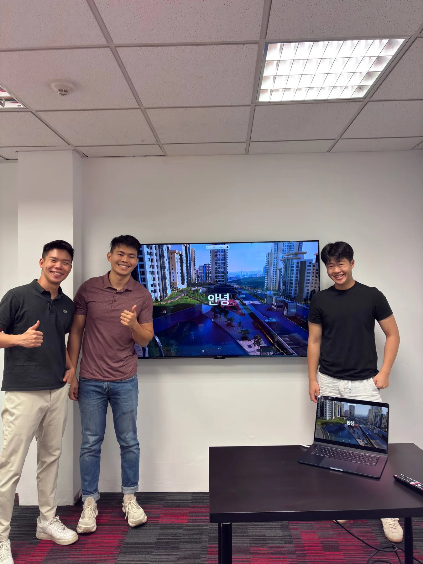 Students and a mentor celebrating their finished project